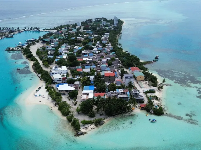 Bird's-eye view of Dhiffushi island showcasing beautiful turquoise waters and beaches